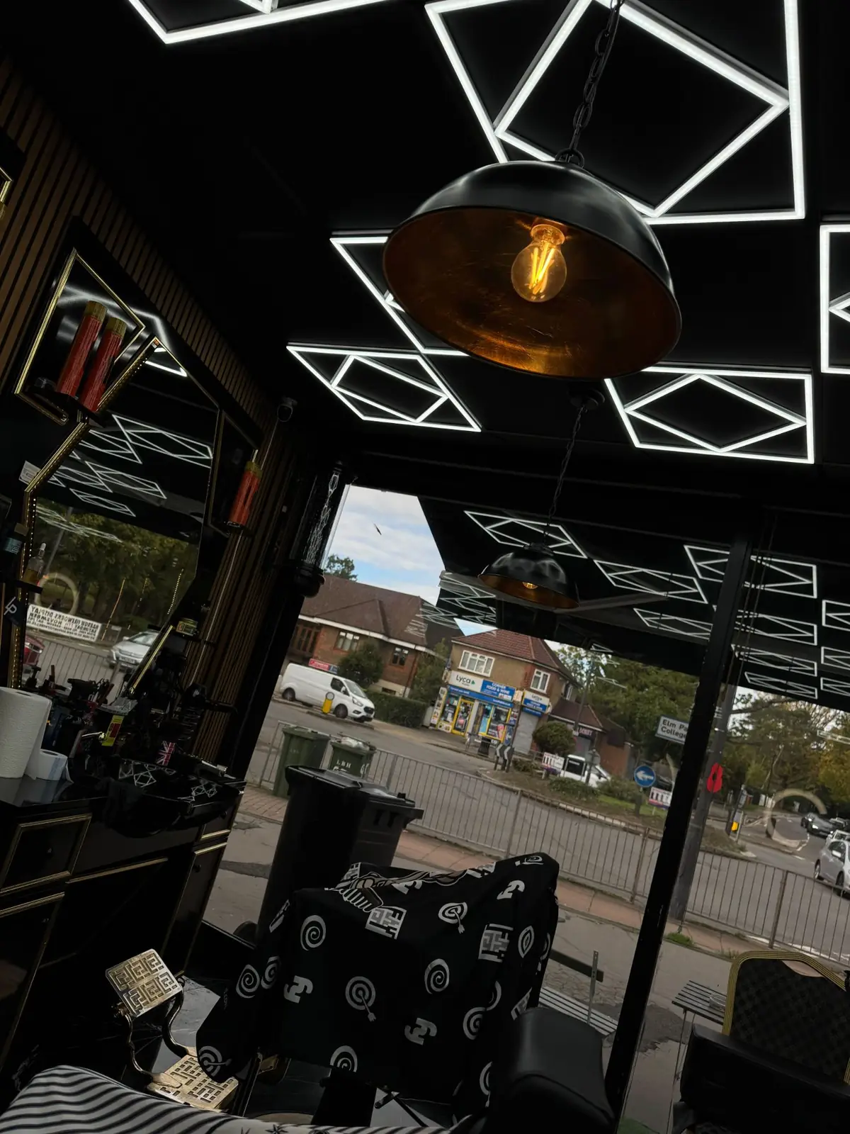 Geometric LED ceiling lights and a pendant lamp by the front window