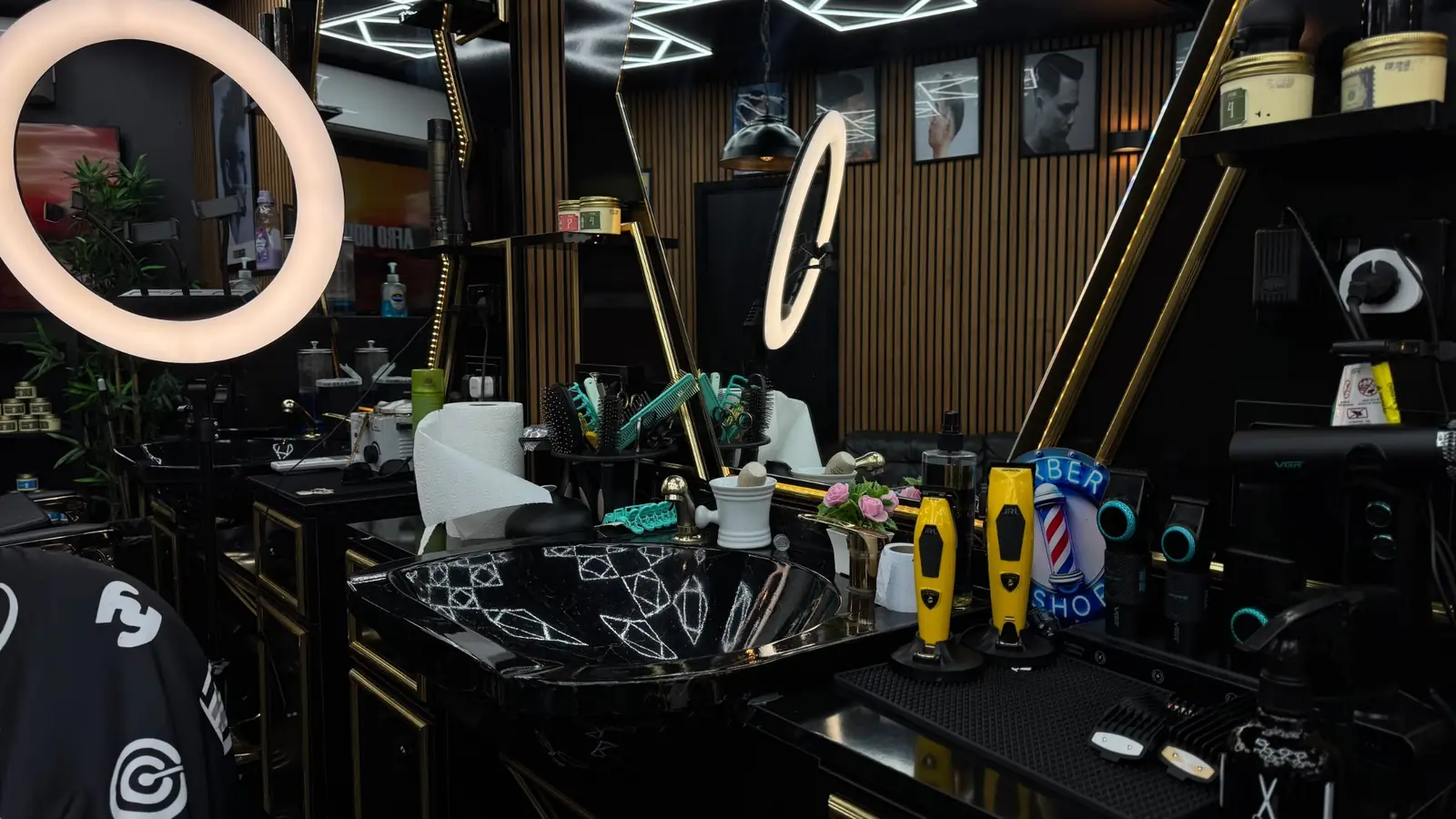 Clippers, combs and a ring light at a barber station